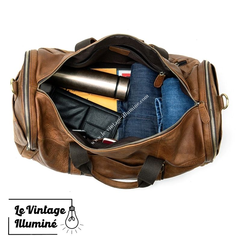 Un sac en cuir écologique marron flotte sur un fond gris Une Un sac en cuir écologique marron flotte sur un fond gris Une